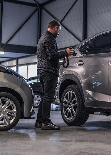 Fotograaf van Best autotaxaties die foto's maakt van de auto
